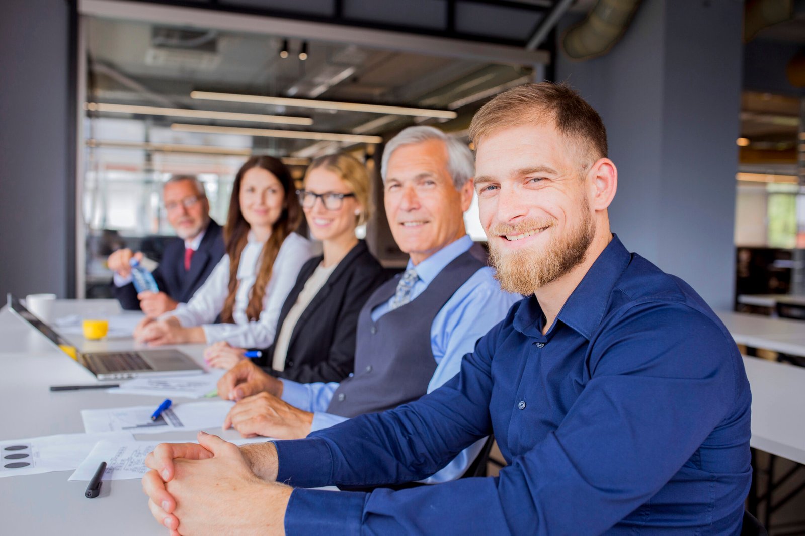 confident-smiling-businesspeople-sitting-together-business-meeting confident-smiling-businesspeople-sitting-together-business-meeting